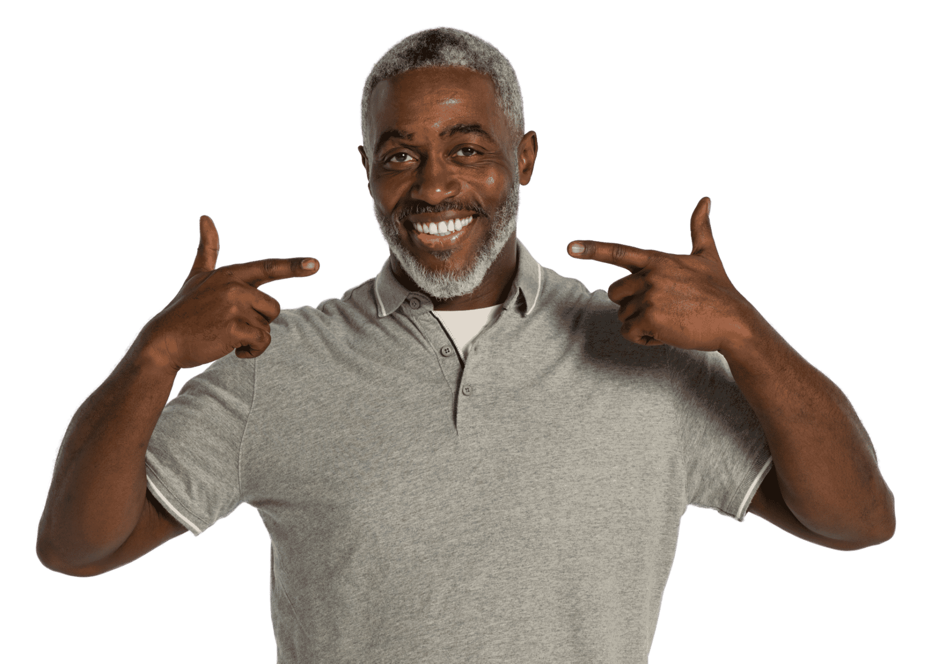 Older man pointing at his smile in a grey shirt.